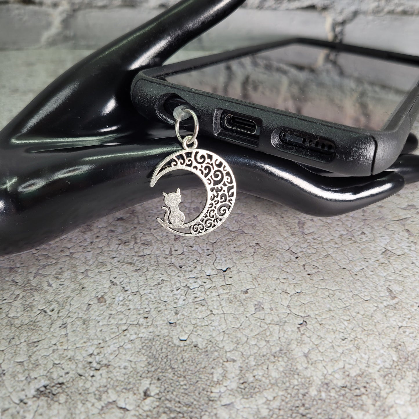 Pendentif pour cellulaire sur bouchon anti-poussière