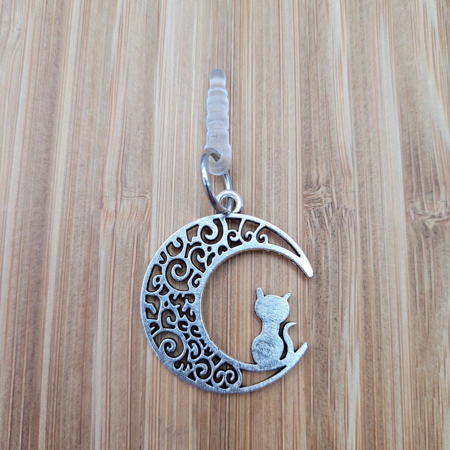 Pendentif pour cellulaire sur bouchon anti-poussière