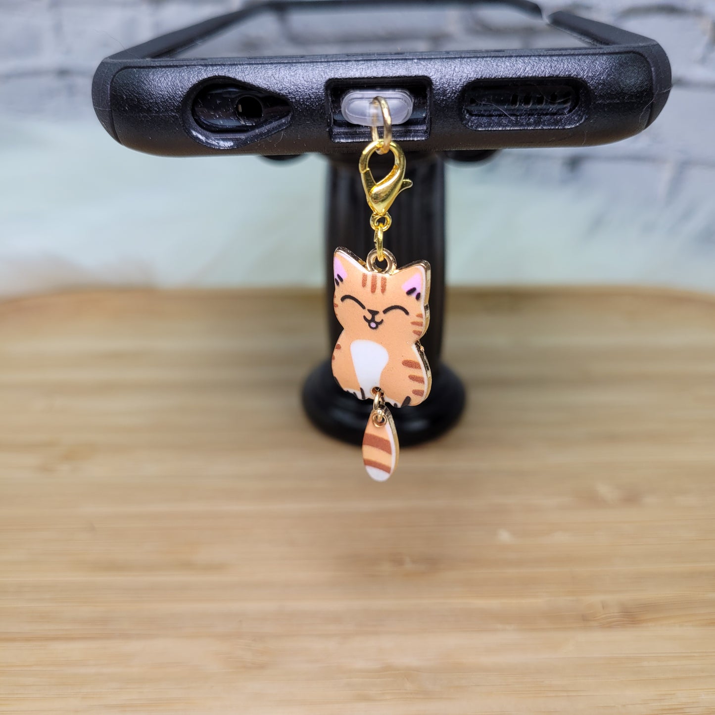 Pendentif pour cellulaire sur bouchon anti-poussière