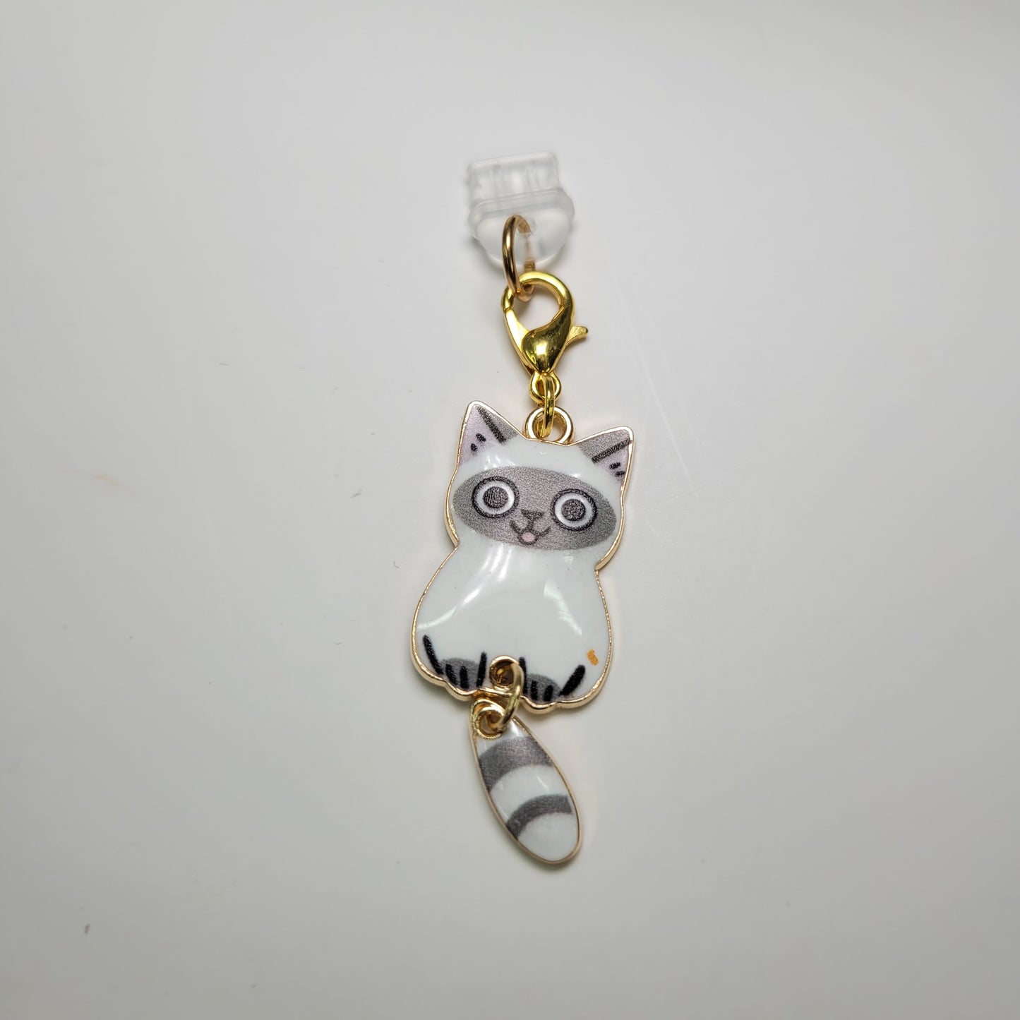 Pendentif pour cellulaire sur bouchon anti-poussière