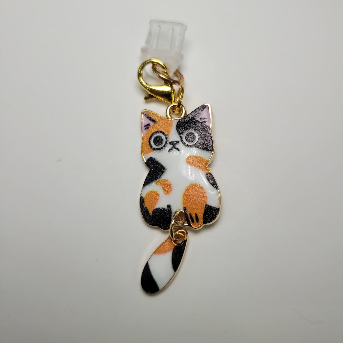 Pendentif pour cellulaire sur bouchon anti-poussière