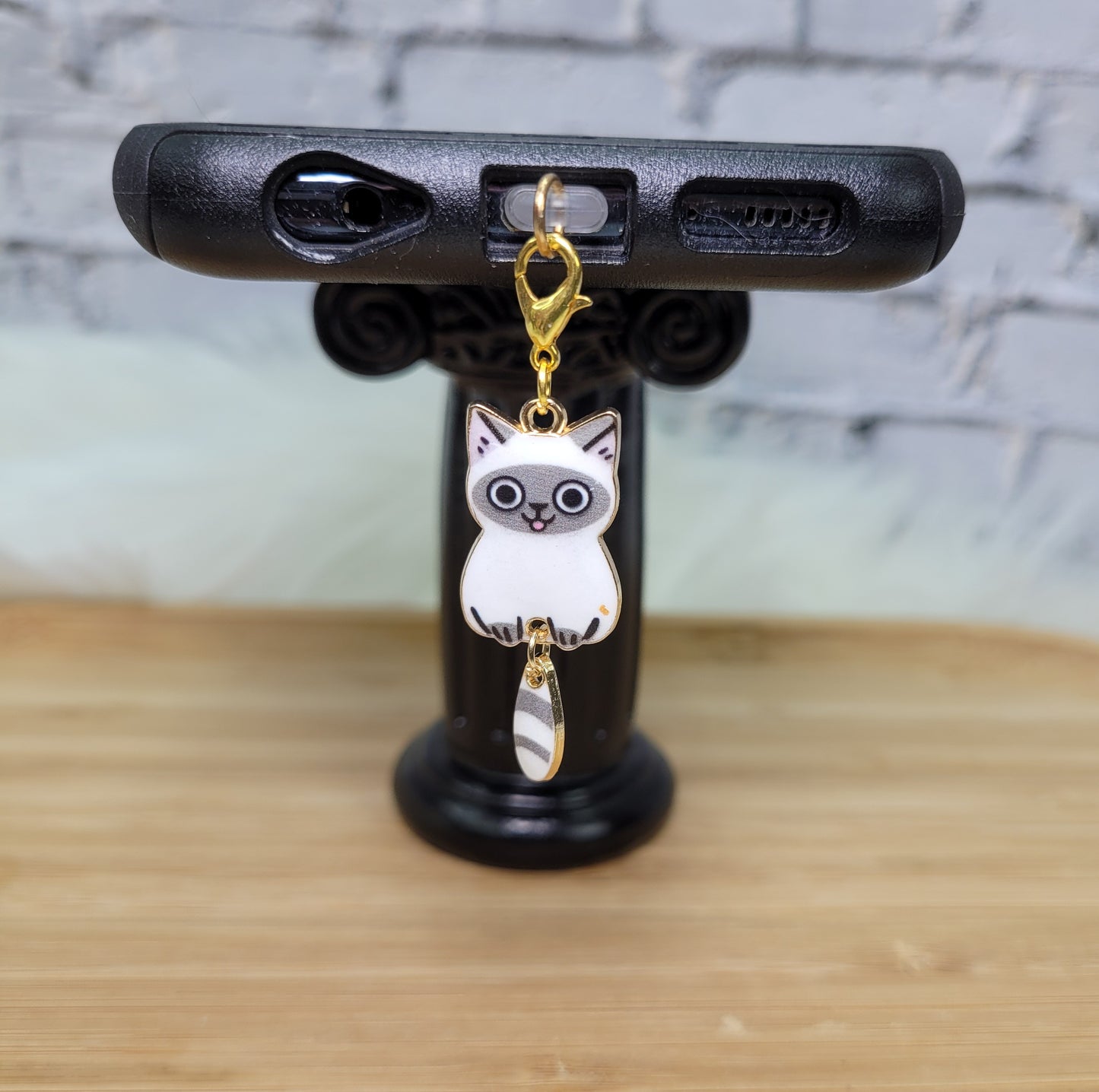 Pendentif pour cellulaire sur bouchon anti-poussière