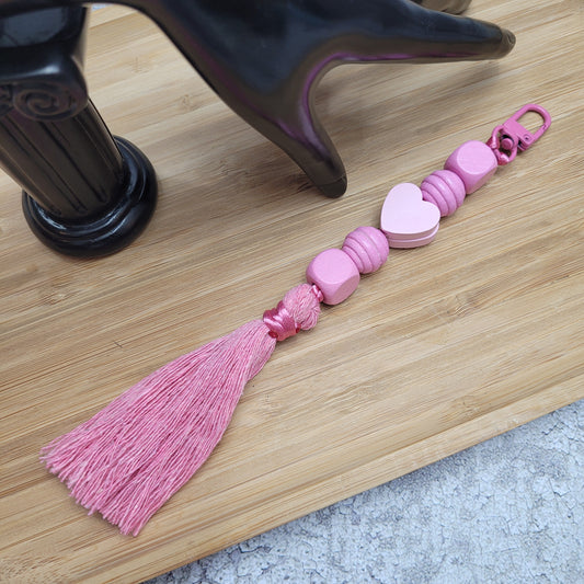 Bijou/porte-clés fait en perles de bois
