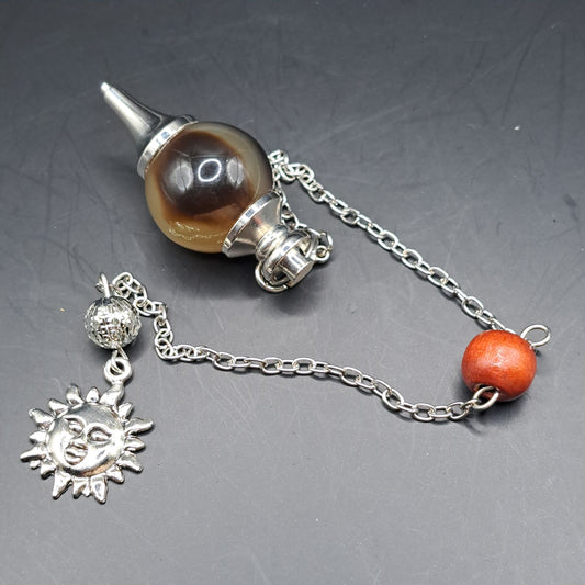 Pendule imitation corne de yak breloque soleil