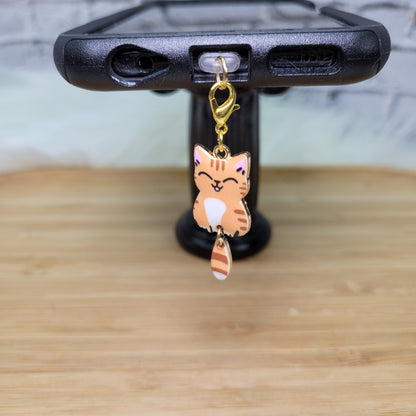 Pendentif pour cellulaire sur bouchon anti-poussière