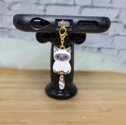 Pendentif pour cellulaire sur bouchon anti-poussière